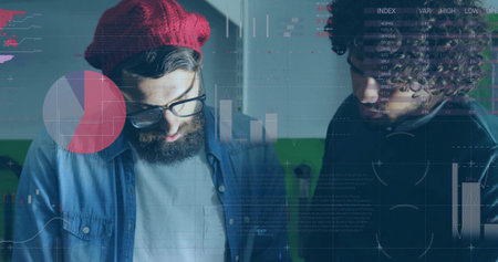 Leaning two colleagues reviewing visual data overlays in office, with denim shirt and dark jacket....
