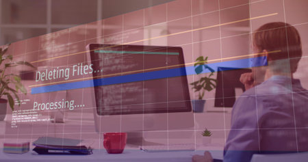 Sitting man wearing collared shirt viewing code on office monitor with deleting overlay, copy space. Workspace, professional, desk, screen, plant, mug, notebookの写真素材