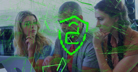 Leaning three team red tie man and blouses viewing laptop in office showing green shield overlay....