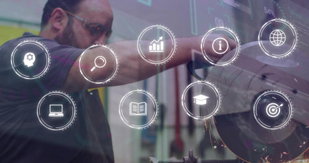 Guiding worker in dark polo, goggles, cutting metal at grinder at shop with HUD-icons and sparks. Workshop, machinery, operator, safety, overlay, industrialの写真素材