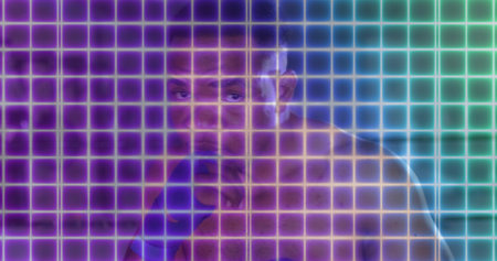 Standing shirtless boxer holding guarded pose in neon studio, with blue hand wraps and glowing grid....