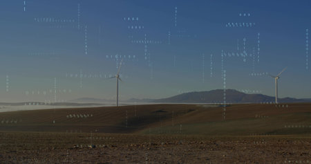Standing white wind turbines spanning ridge on rural plains, showing valley fog and binary overlay....