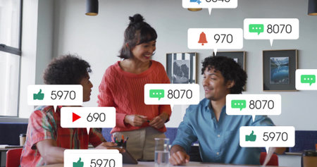 Standing woman in rust sweater guiding men in plaid and blue shirts in office, laptop alerts. Teamwork, collaboration, ideation, coworking, workspace, modern, vibrantの写真素材