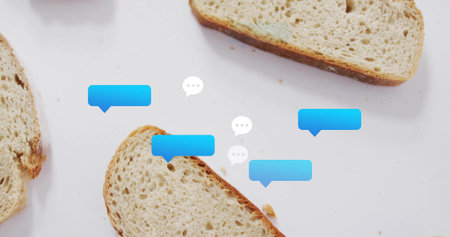 Displaying whole-grain bread slices and crumbs on white tabletop with blue and white speech bubbles....