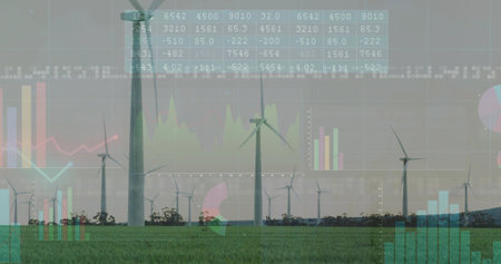 Displaying wind turbines with three-blade rotors rotating over grassy field, showing chart overlays....