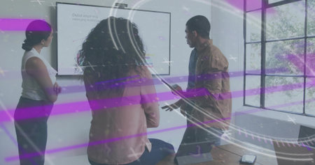 Pointing man in business wear holding tablet at screen in office with laptop and AR overlay. Presenter, conference, boardroom, display, collaboration, teamwork, daylightの写真素材