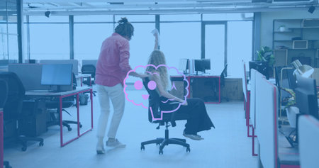 Pushing coworker rolling woman seated task chair through office in casual attire. Workspace,...