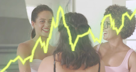 Standing three women wearing sleeveless tops and glasses in studio with mirror and neon waveform. Trio, friends, backlit, reflective, workspace, windows, casualの写真素材