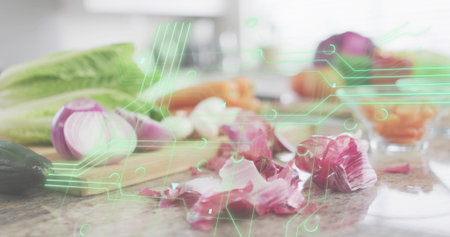 Sitting halved red onion and papery skins crowding stone countertop in kitchen, AR overlay. Produce, cuttingboard, romaine, cucumber, carrots, bowls, reflectionsの写真素材