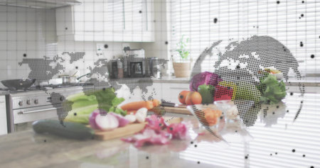 Displaying vegetables with chef's knife on wooden cutting board in kitchen, globe overlaying scene. Produce, colander, blade, countertop, daylight, window, worldmapの写真素材