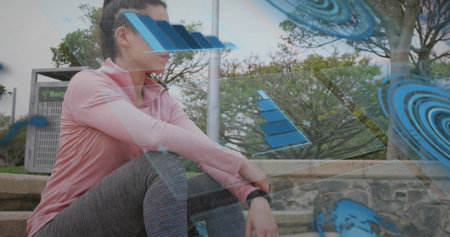 Sitting adult woman wearing pink zip-up top and gray leggings on park steps, smartwatch visible. Outdoor, fitness, athleisure, greenspace, urban, geometric, overlaysの写真素材