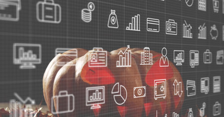 Displaying three small orange pumpkins resting on wooden tabletop with hay, digital finance icons. Gourds, harvest, autumn, textured, grid, overlay, chartsの写真素材