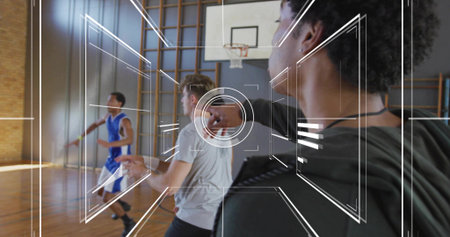Running group of male players practicing in school gym wood court with backboard, blue jersey, HUD....