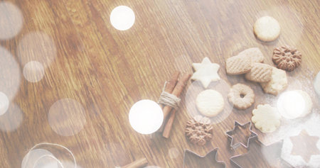 Displaying baked cookies, metal star cutters, cinnamon, powdered sugar on wood table, copy space. Baking, festive, warm, kitchen, flour, softfocus, cozyの写真素材