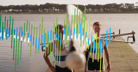 Standing rowing duo wearing striped unisuits on dock at calm lake, holding oars, boat, waveform....