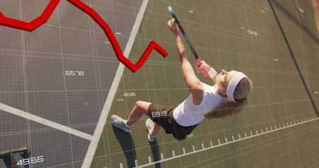 Serving player in white headband, black skirt hitting ball with racket on hard court. Tennis, serve, athlete, sunlight, outdoor, vibrant, focusの写真素材