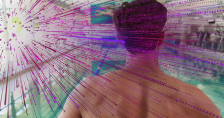 Standing shirtless adult male facing pool lanes in public aquatic center, showing magenta overlay....