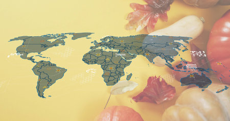 Displaying stylized map overlay on yellow backdrop, showing data markers, autumn leaves, pumpkins....