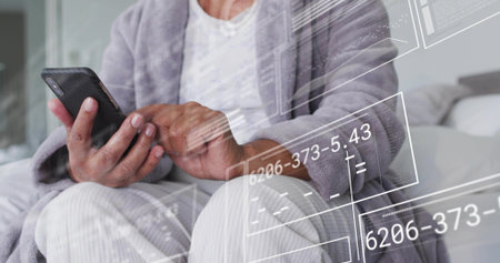 Animation of financial data and graphs over blue backgroundの写真素材