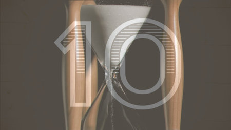 Hourglass in flat-design is showing sand flowing through wood frame. Timing, minimalist, vintage, meditation, countdown, serenity, sculptureの写真素材