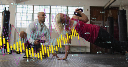 Pulling woman onehanded and rowing kettlebell in gym in magenta top, coach crouching, chart overlay....