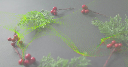 Displaying wreath of evergreen sprigs and red berries on gray tabletop, showing green particle wave....