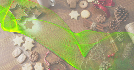 Sweeping neon-green mesh overlay spanning wood table, obscuring star cookies, pine cones, cinnamon....