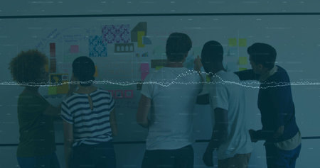 Reviewing five coworkers pointing at writable wall in office, showing Post-it waveform overlay....