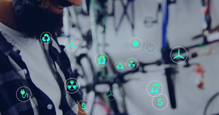 Tightening bearded man in plaid shirt fixing bike bolts at workshop with copy space. Mechanic, bicycle, repair, shop, toolsの写真素材