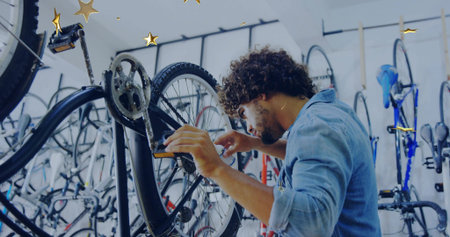 Repairing mechanic adjusting rear wheel and cassette on black bike in shop wall racks, denim-shirt....