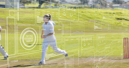 Running mature female cricketer sprinting along pitch at local park, wearing white uniform. Cricket,...