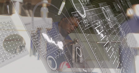 Displaying HUD overlaying blurred desk with laptop, reflecting man in dark shirt, cap holding cup....