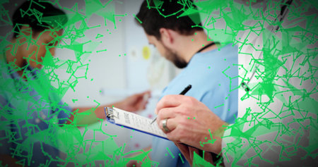 Writing doctor in white coat with blue clipboard noting gowned patient in clinic, green overlay....