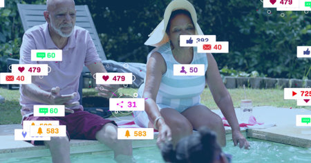 Reaching senior woman leaning toward child at poolside, in striped suit, sunhat and social overlays....