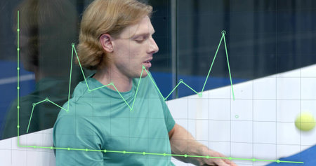 Reaching man wearing teal T-shirt on sports court, with yellow tennis ball and green graph overlay....