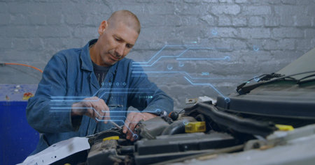 Adjusting mechanic in blue coverall with wrench fastening inside engine bay in garage, with HUD....
