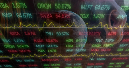 Showing glossy ticker at trading desk showing tickers, yellow line charts, globe, phone reflection....