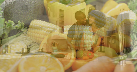 Cooking couple, man wearing striped apron, chopping veggies on kitchen counter, with corn, avocado....