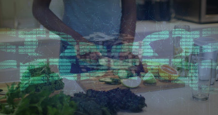 Slicing woman in sleeveless white top chopping cucumbers and limes in kitchen, board. Fresh,...