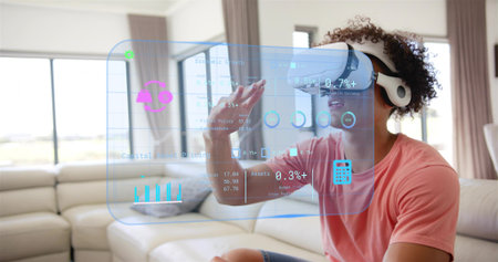 Reaching adult male wearing coral t-shirt, white VR headset using hologram at home, copy space....