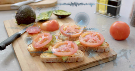 Displaying avocado-topped rustic bread slices on wooden cutting board in home kitchen, with knife....