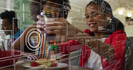 Smiling girl in red hoodie studying on tablet at study table, with data overlays, copy space....