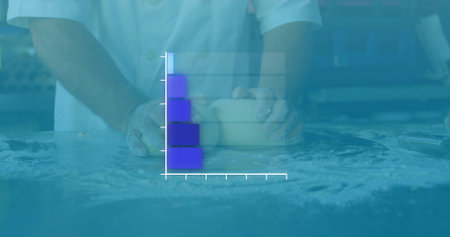 Kneading dough male chef wearing white jacket at flour-dusted countertop, showing bar-chart overlay....