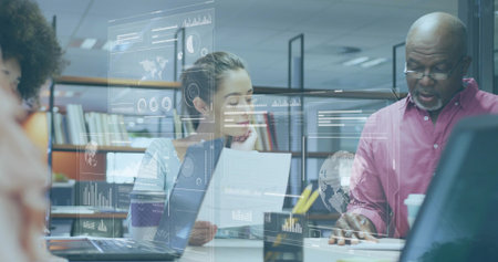 Analyzing team wearing business-casual attire reviewing documents at office, with laptops, overlays....