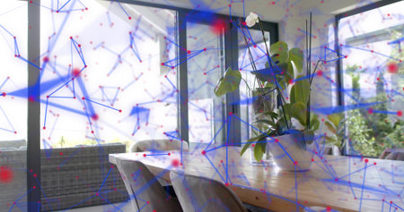 Showing orchid in white pot sitting on wooden table in dining area, with blue red overlay. Interior,...