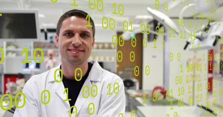 Standing male researcher wearing white lab coat studying screens at lab bench, green binary overlay....