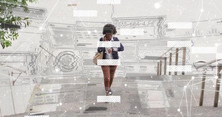 Walking woman in navy blazer brown pants descending urban steps, checking phone. Professional,...