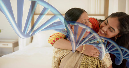 Embracing mother daughter on bed at home, wearing sarees, bangles, bedside lamp, DNA overlaying. Affectionate, intimate, overlay, duo, bedroom, traditional, jewelryの写真素材