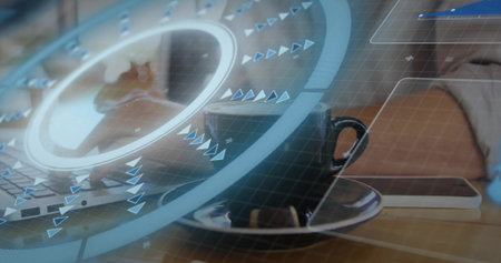 Showing black coffee cup on saucer at cafe table with phone, laptop, interface and light sleeve....