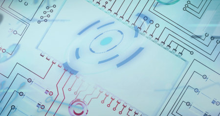 Displaying central translucent panel showing concentric rings and circuit traces in studio flatlay....
